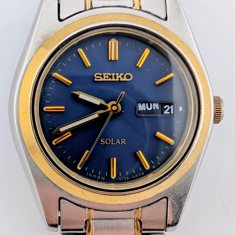 Seiko Solar V138-0AA0 Blue Sunburst Day/Date Two Tone Women's 25mm Watch